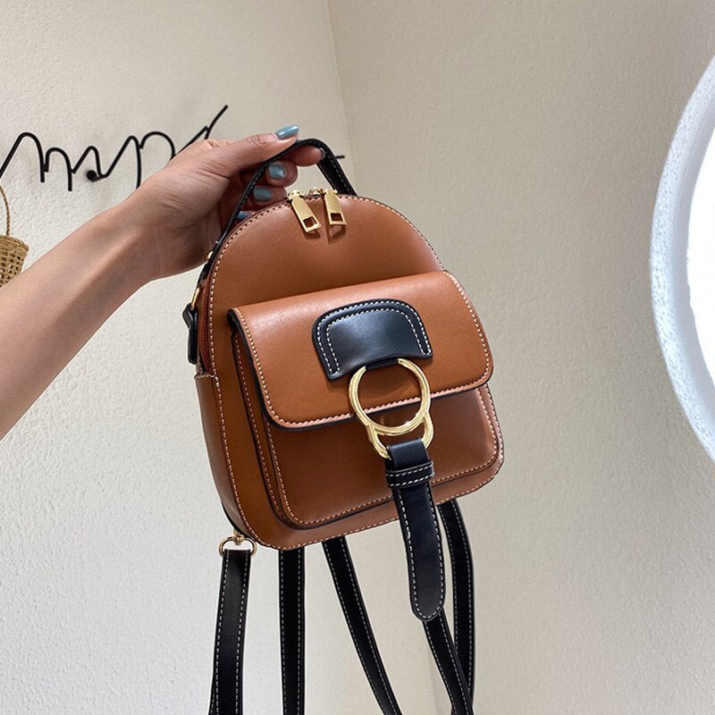 Mochila pequena feminina de couro artificial, nova bolsa de ombro da moda em couro ecológico, versão coreana, mochila universitá